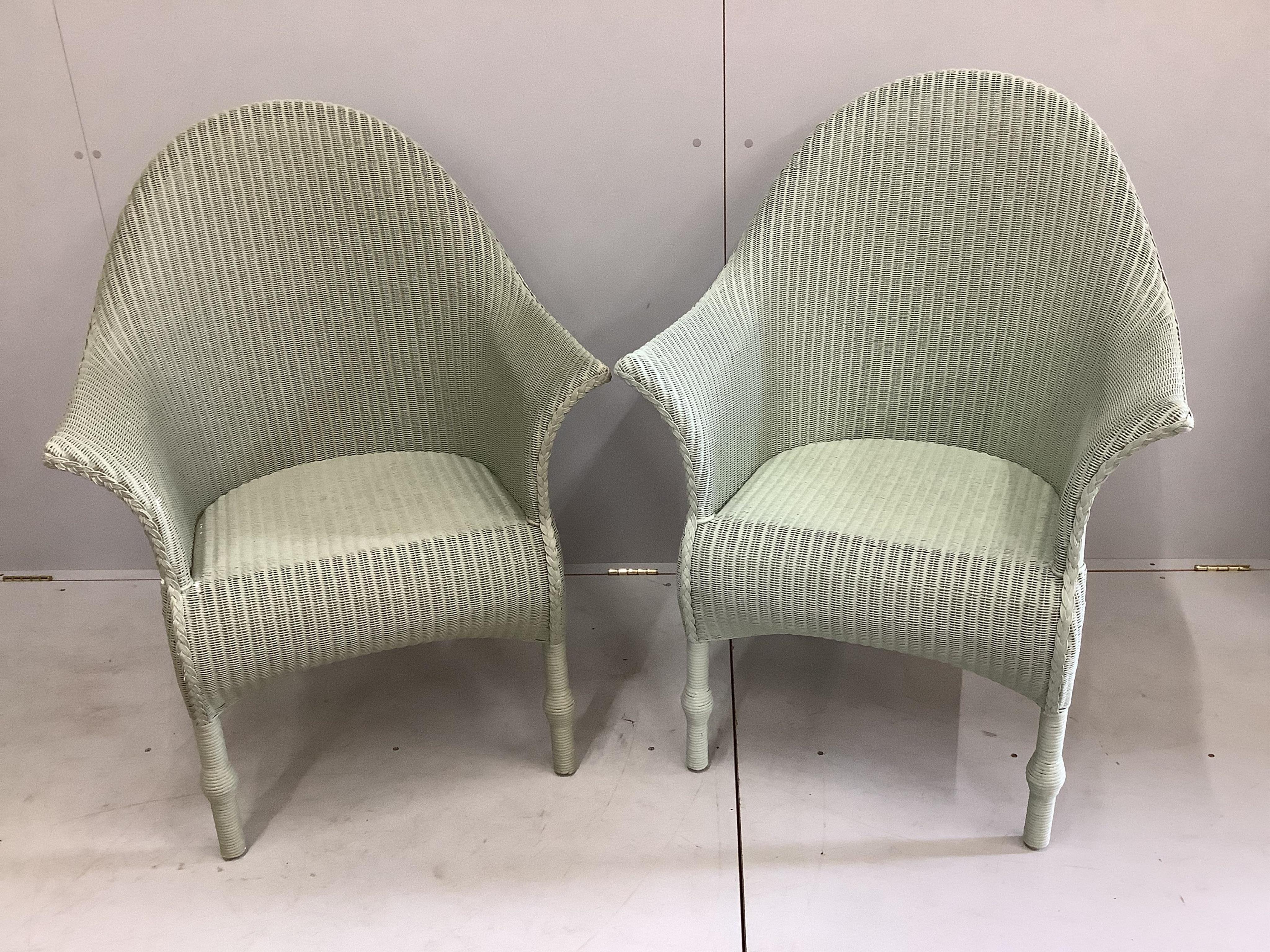 A pair of modern 'Lusty' Lloyd Loom armchairs with loose cushion seats, width 75cm, depth 60cm, height 102cm. Condition - good